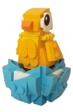 a yellow chick made of legos sitting in a blue eggshell