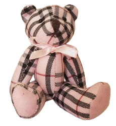 a pink-and-black plaid bear with moveable limbs and a small pink bow around its neck