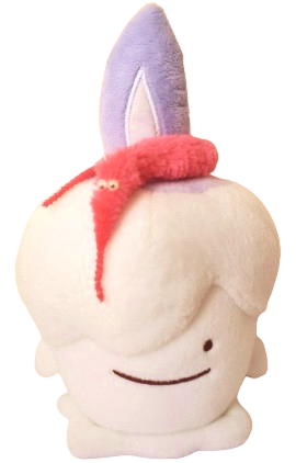a pokemon plushie of a ditto pretending to be a litwick. it had a pink worm-on-a-string draped around it's flame.