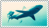 a stamp of a shark swimming in light blue water